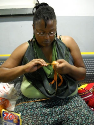 women crochet together for coral reefs